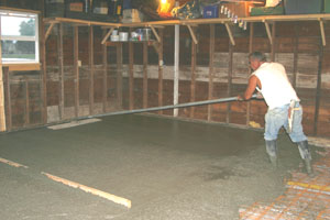 How do you pour a concrete floor in a garage?